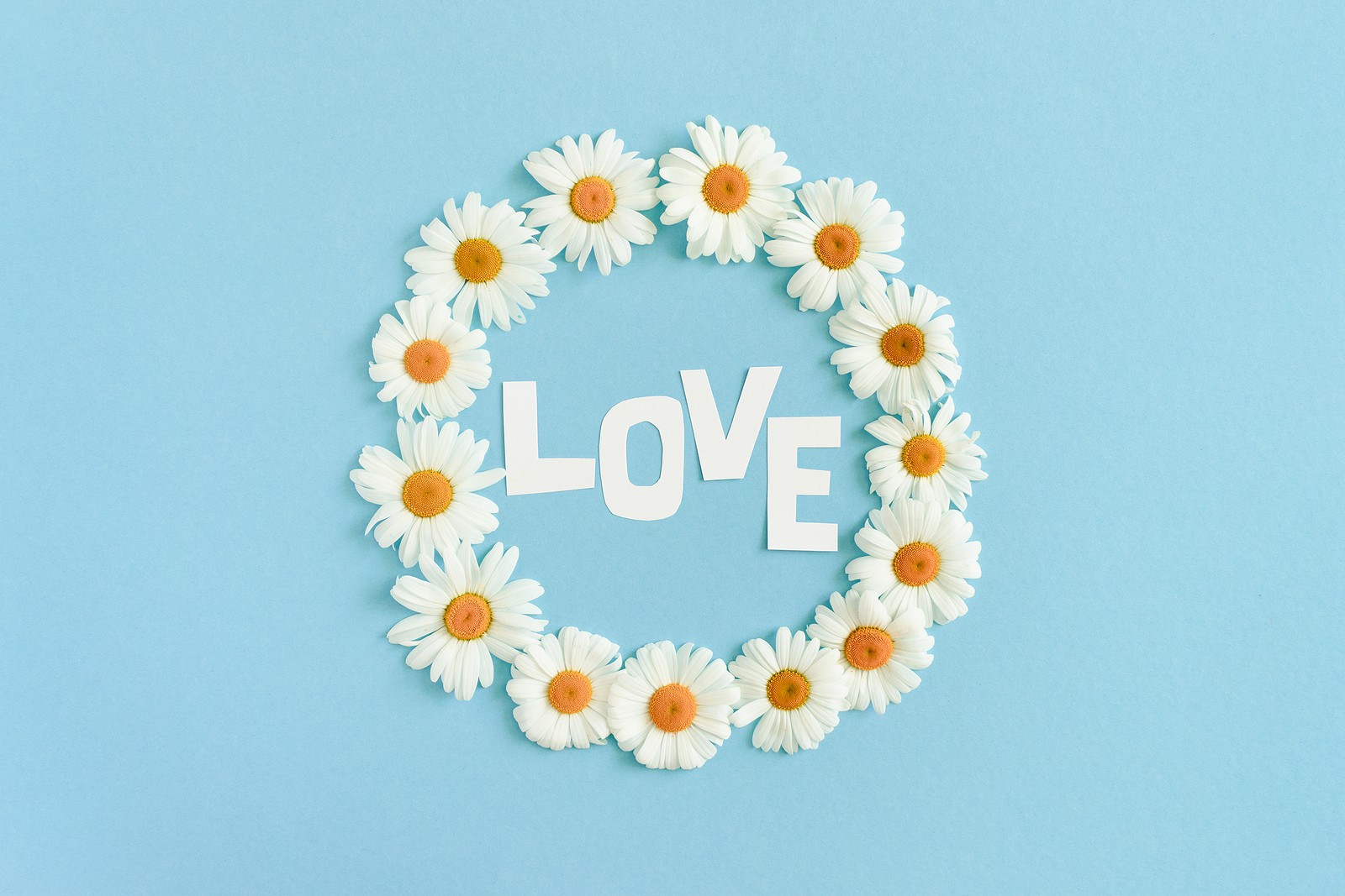 Word Love Made Of Letters Cut Out Of Paper. Wreath Made Of White